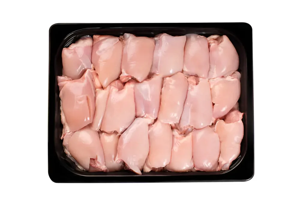 Raw Boneless Chicken Thighs neatly arranged in a black tray.